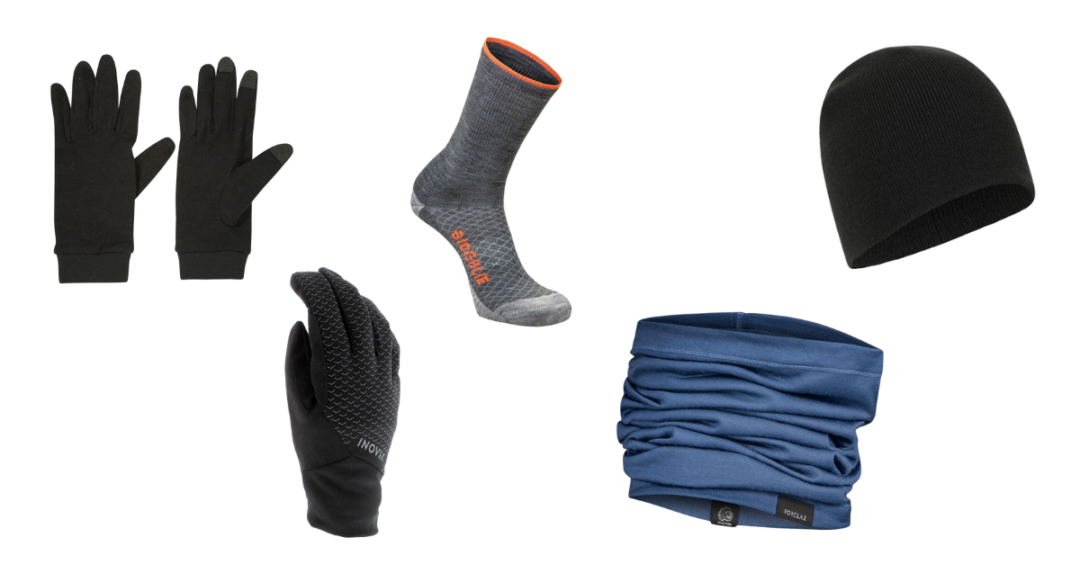 Cross-country skiing winter layering set: black gloves, grey socks, black beanie and blue neck warmer