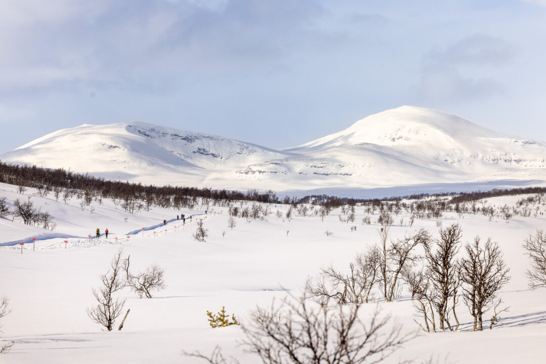 Snowy Swedish mountains with a cross-country ski track winding through a winter valley