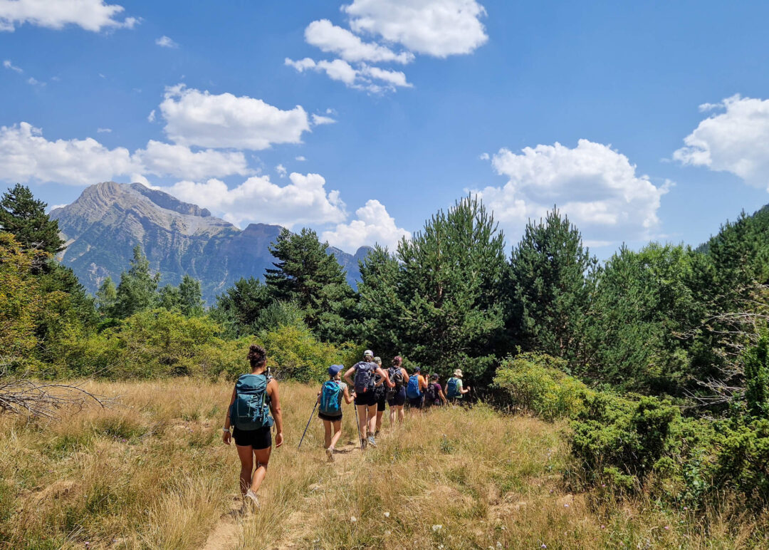 Women hiking on a mountain trail in the Spanish Pyrenees