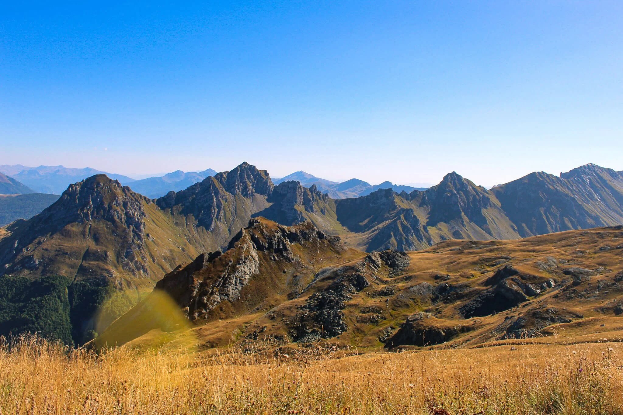 Mountain valley landscape for guided hiking in North Macedonia under clear blue sky