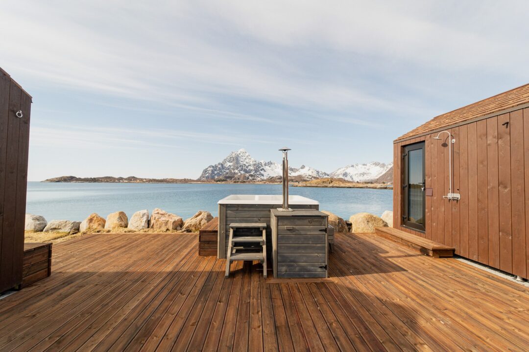 Wooden deck by the sea with mountains in Lofoten, Norway