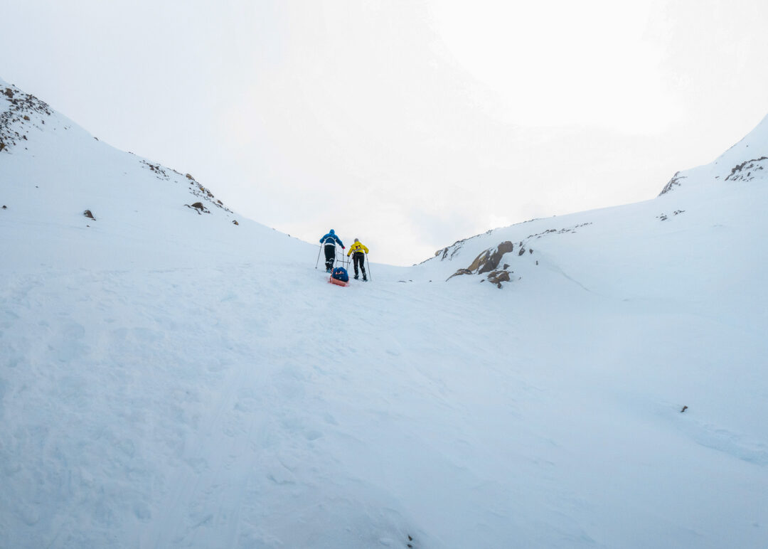 Snowshoer trekking through a snowy mountain valley in the Arctic