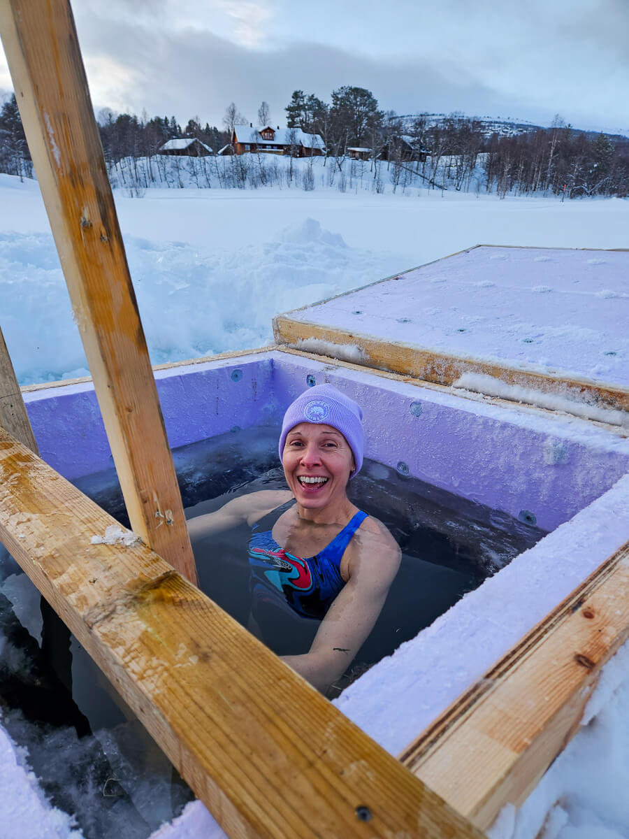 Woman enjoying ice bath outdoors