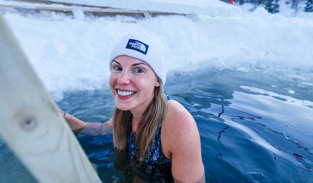 Woman enjoying a winter plunge in Sweden