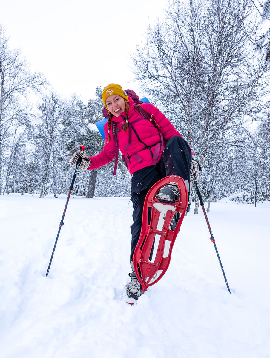 Woman snowshoeing in snowy landscape in Sweden