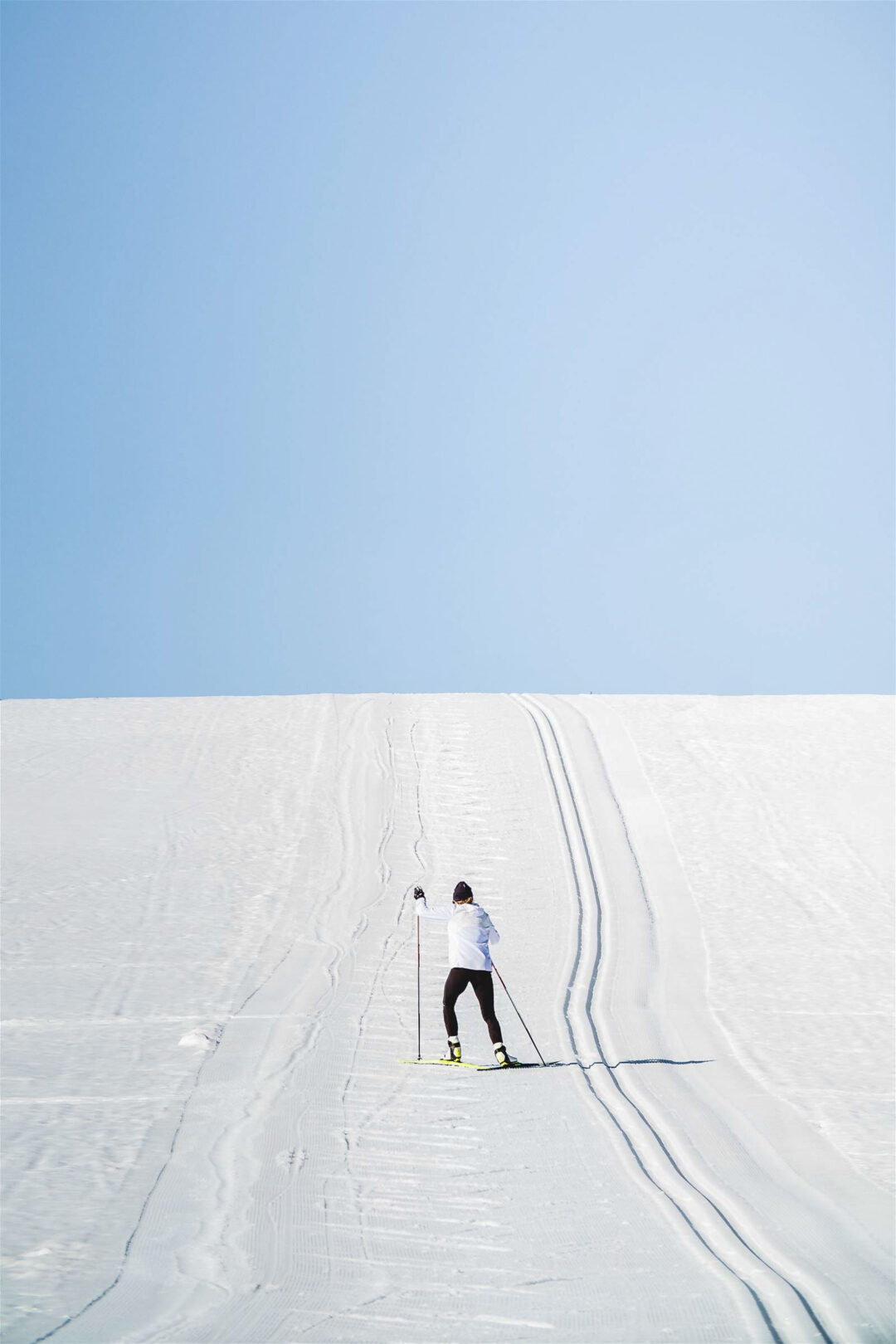 Woman skiing on a snowy slope in Sweden