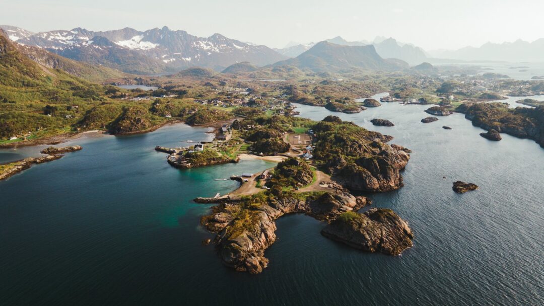 Aerial view of rugged Lofoten fjords and islands with winding waterways along the coastline