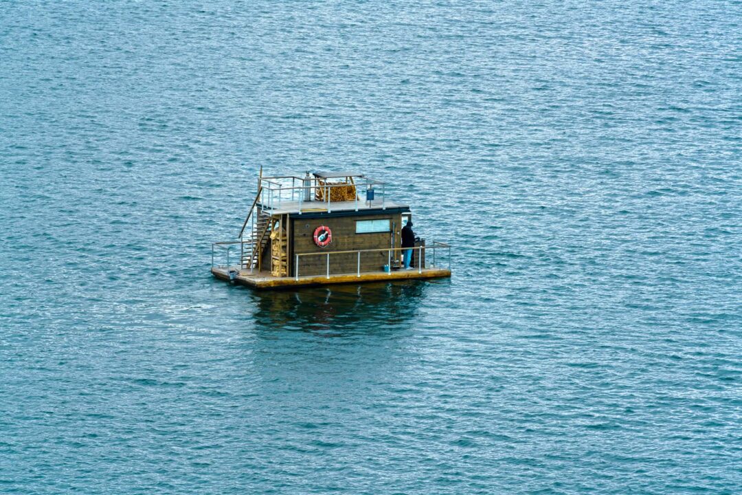 Small boat floating on open water in Oslo fjord waters