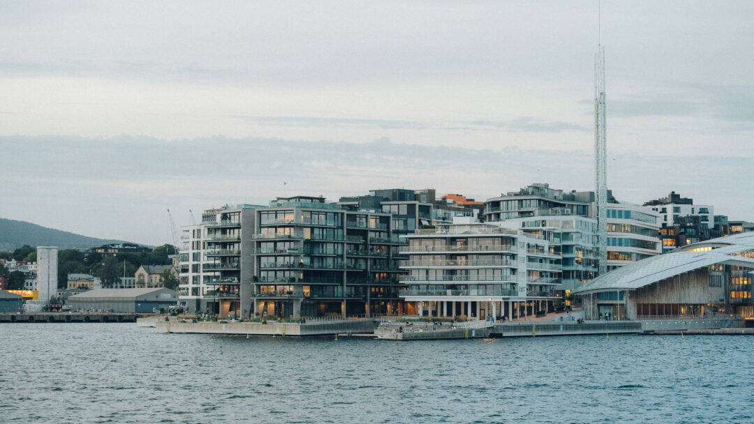 Oslo waterfront view with modern apartment blocks along the harbour skyline.