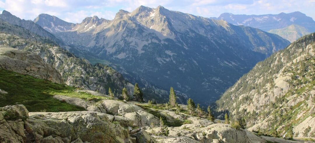 Hiking trail across rocky peaks and valleys in the Spanish Pyrenees mountain range