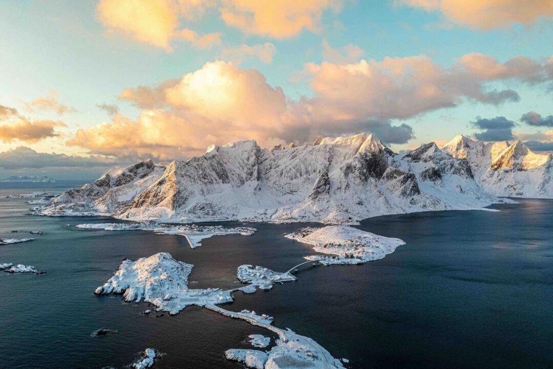 Snowy coastal mountains and fjord in North Iceland in winter, aerial view