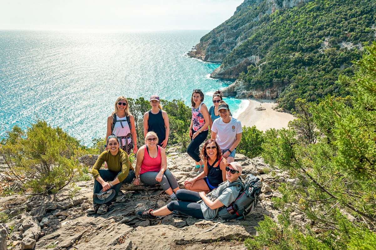 Women hikers on a coastal trail with sea views, Sardinia’s east coast hiking adventure