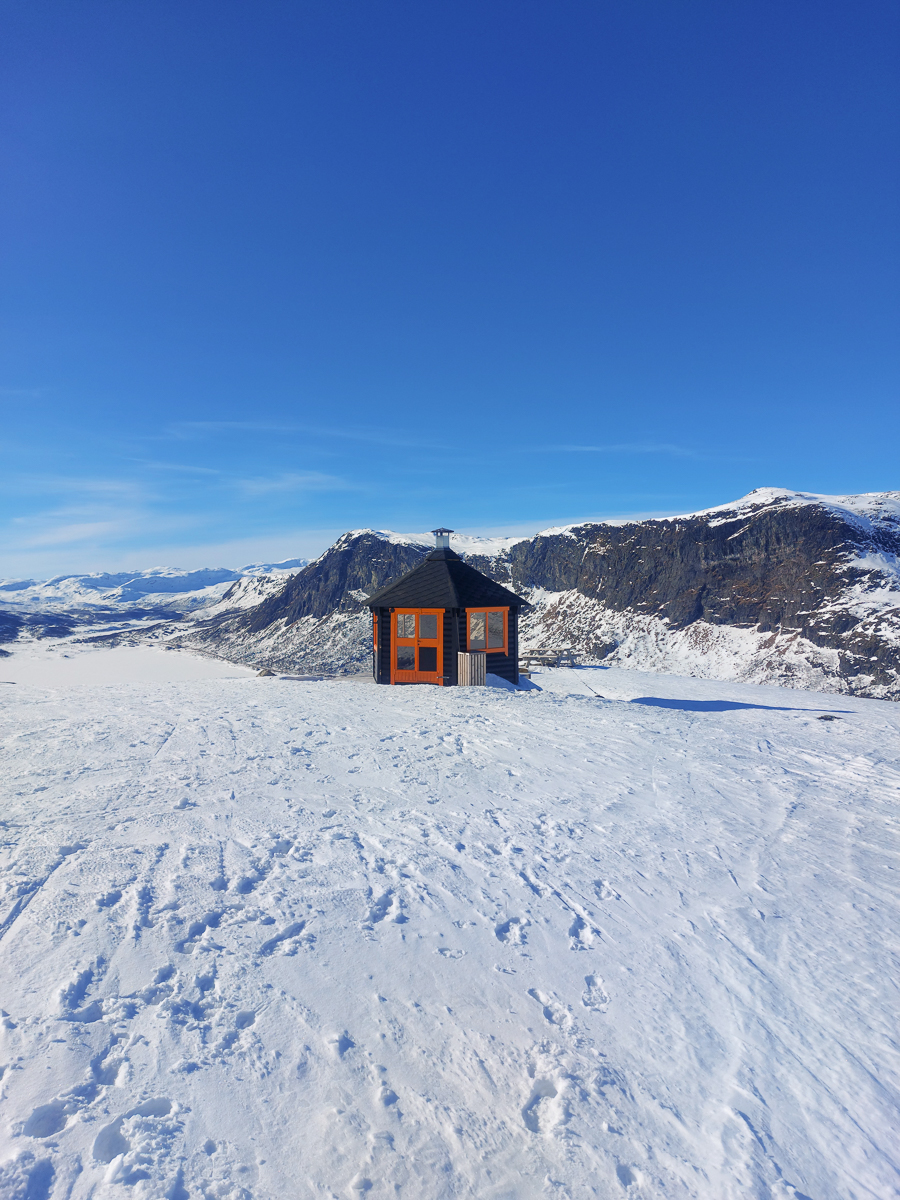 Isolated cabin in snowy landscape