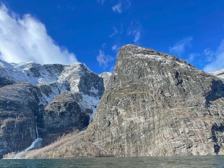 Jotunheimen National Park rugged mountain peaks and valley under a blue sky