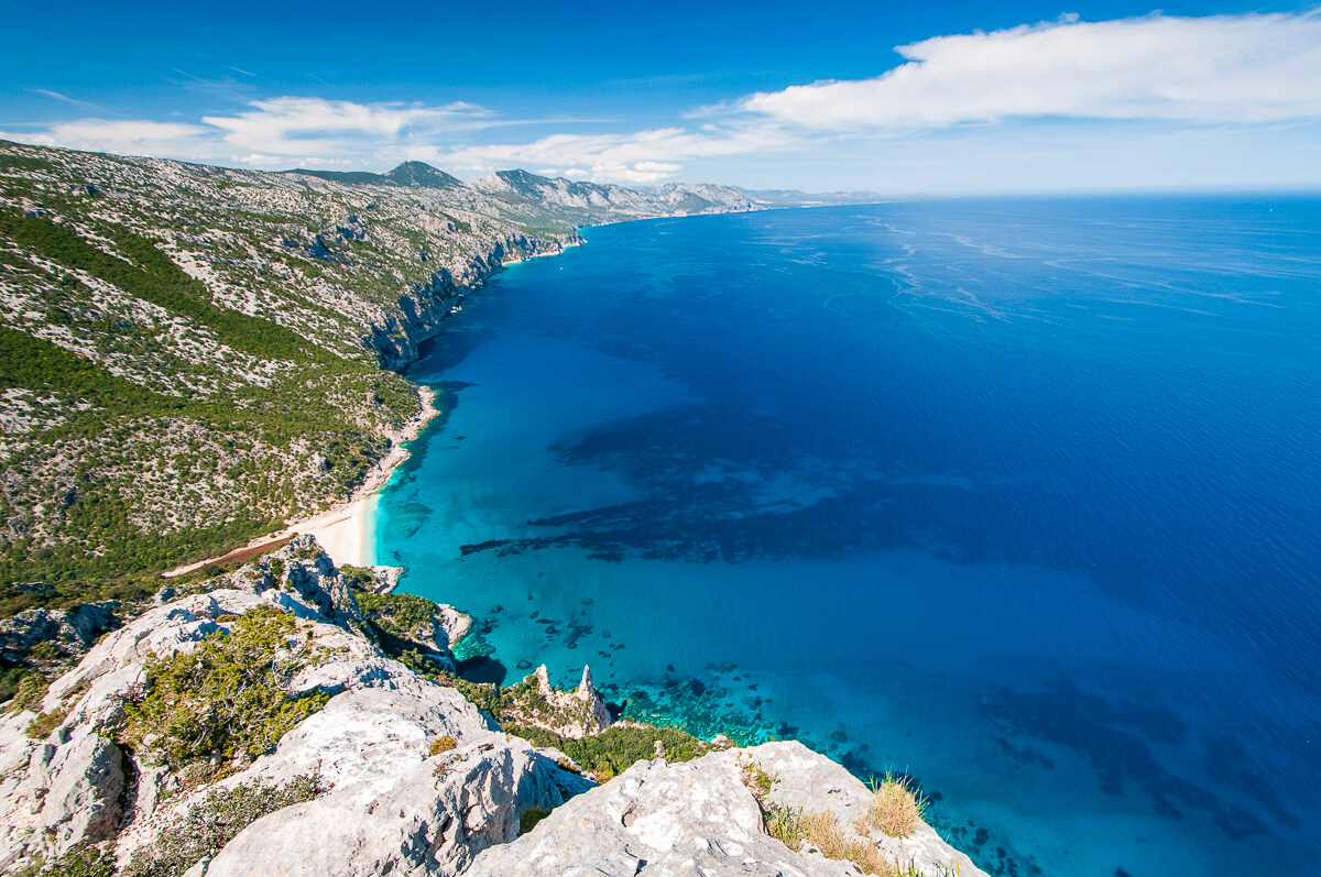 Rocky viewpoint over Sardinia’s east coast, turquoise sea and long sandy shoreline for hiking views