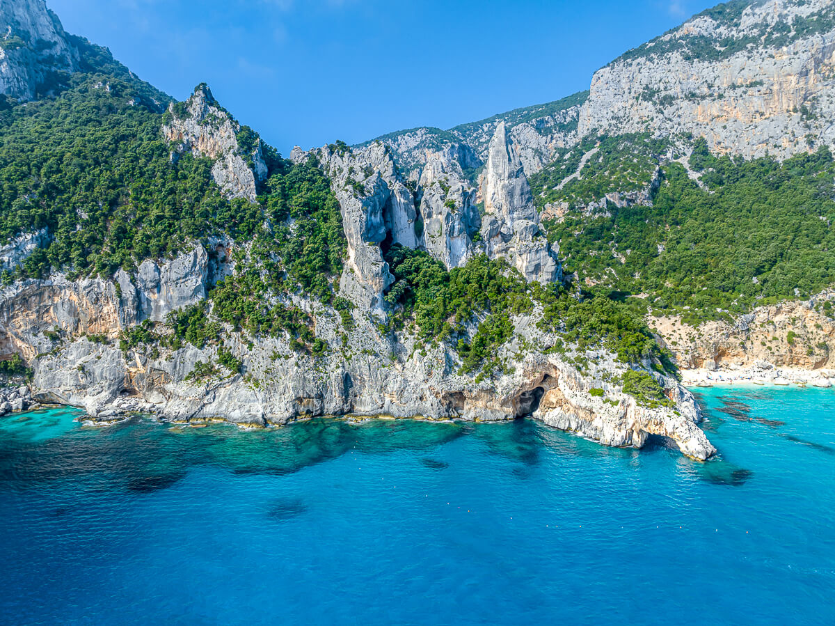 Dramatic coastal cliffs and turquoise sea scenery on Sardinia’s east coast for hiking adventures