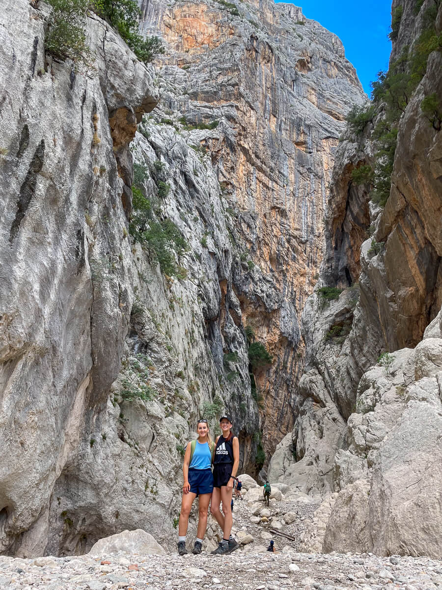 Women hiking in a rocky canyon in East Sardinia