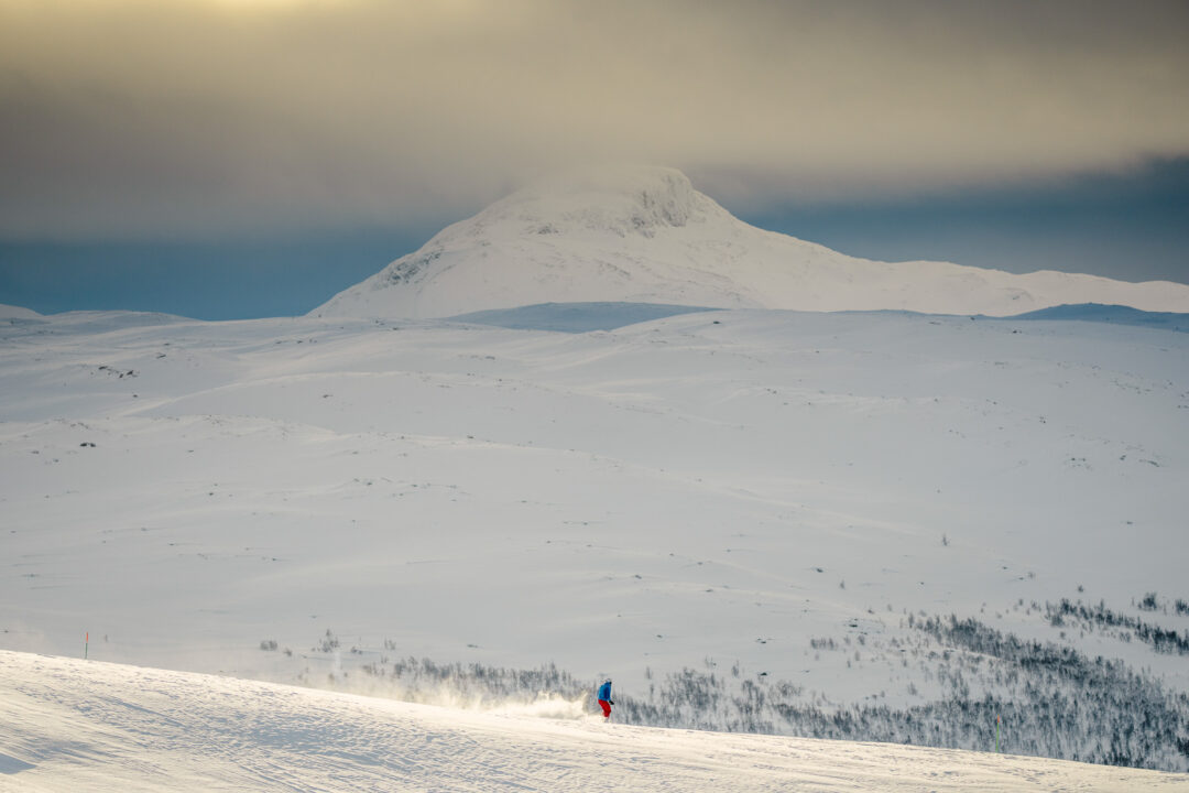 Snowy landscape with lone skier
