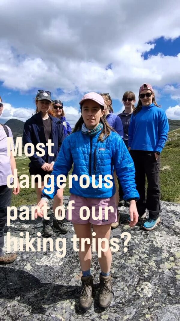 Women hiking on a rocky hillside under cloudy sky: “Most dangerous part of our hiking trips?”