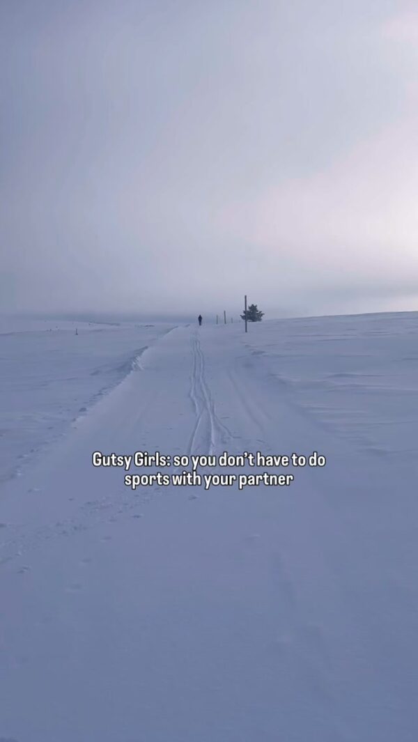 Women cross-country skiing on snowy track; “Gutsy Girls: so you don’t have to do sports with your partner”